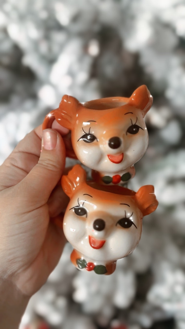 Set of 2 Retro Reindeer Shot size Mugs.    Meet our teeniest tiniest, most delicate set of mini mugs you ever did see! We designed these 'Mug shots' to be even smaller than our exclusive mini mugs, to be a sweet and unique addition to your holiday decor. A Tea party for 2 with your littles. A fun festive shot or espresso. So versatile and fun. The perfect gift for a child or a child at heart.        Measures 6cm * 
